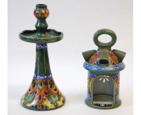 AN EARLY TWENTIETH CENTURY DUTCH GOUDA POTTERY CANDLESTICK, 12" (30.5cm) high and a  GOUDA POTTERY LANTERN, both decorated in