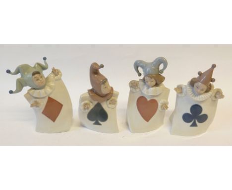 FOUR NAO PORCELAIN FIGURES OF CHILDREN DRESSED AS JESTERS OR CLOWNS, each costume representing individual card suit, approx 7