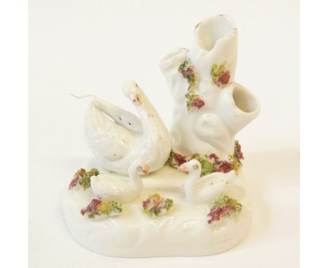 A SMALL STAFFORDSHIRE PORCELAIN SPILLHOLDER GROUP, SWAN AND TWO YOUNG BEFORE A TREE TRUNK, floral detail, 3" (7.6cm) wide