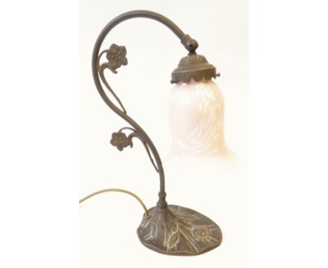ART NOUVEAU STYLE PATINATED METAL TABLE LAMP, with foliate scrolling stem and pink and white flecked glass shade, 14 3/4" (37