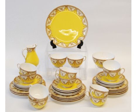 ROYAL WORCESTER CHINA TEA SERVICE FOR 12 PERSONS, brown and cream border of foliate swags and branches, yellow main ground, i