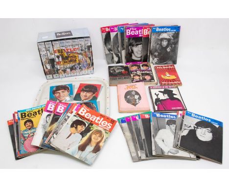 A collection of Beatles Memorabilia including 74 Beatles Monthly Magazines plus 4 Beatles Books and one hard back book John L