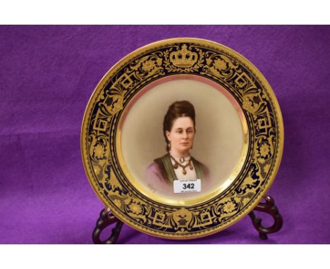 A Royal Vienna hand-painted portrait plate, having a well painted central portrait of a young woman, signed Wagner, all withi