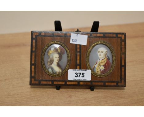 A pair of 19th century hand-painted portrait miniatures, depicting Louis XVI and Marie Antoinette, each of oval form and held