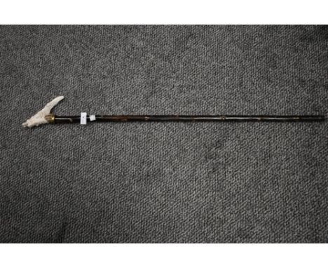 A late 19th / early 20th century walking stick, the antler handle intricately hand carved depicting Chinese dragon, L89cm.
