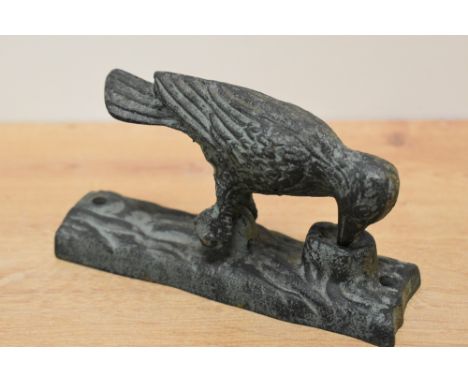 A reproduction cast iron woodpecker door knocker, h16cm