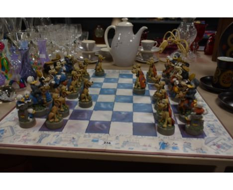 A 32 piece Walt Disney chess board, to include figures such as Minnie, Pluto, Goofy and Micky Mouse