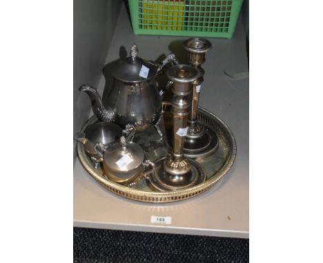 An early 20th century Mappin &amp; Webb style silver plated part tea service, sold together with a pair of candlestick suppor