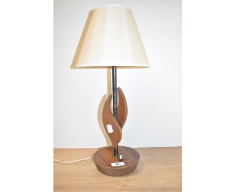 A mid-century teak table top/bedside lamp with shade, H45cm.