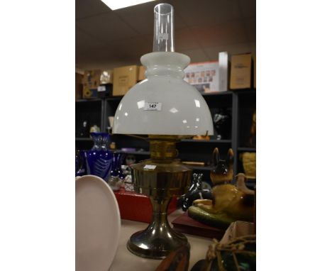 A vintage brass Rayo style oil lamp, having a glass dome top and chimney, h60