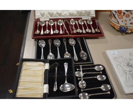 A group of cased silver plated flatware, to include spoons, a two piece baby spoon and food pusher, sugar nips ect.