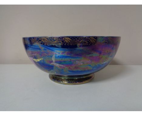 A large Maling lustre bowl modelled with tall ships and birds, numbered 3494  CONDITION REPORT: Wear to gilding. Very fine su