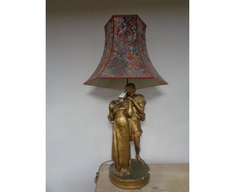 A gilt chalk table lamp in the form of lovers, with shade