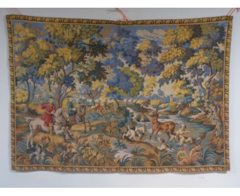 A wall tapestry depicting a hunting scene  CONDITION REPORT: 144cm by 102cm