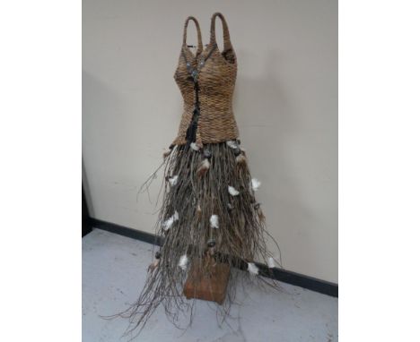 A wicker and twig ornate mannequin 