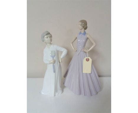 Two large Nao figures - lady in dress and a boy 