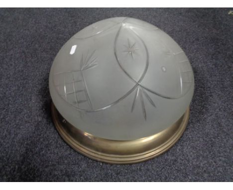 A 20th century etched glass domed light shade with brass mount 
