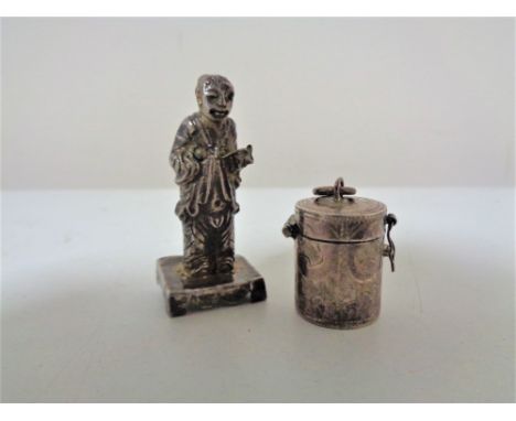 A fine miniature silver pill box pendant together with a continental white metal (probably Chinese silver) figure of a man (2