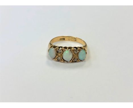 An antique 18ct gold opal and diamond ring