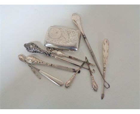 A bag containing silver cigarette case, silver handled button hook etc 