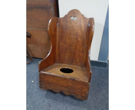A 19th century child's commode rocking chair 
