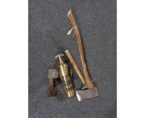 A vintage Pyrene brass fire extinguisher together with a cobbler's last, a hammer and an axe 