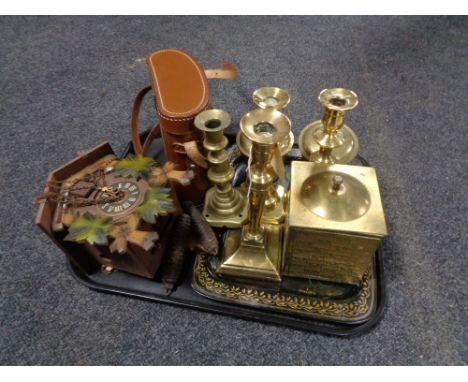 A tray of brass candlesticks, tea caddy, cuckoo clock, binoculars etc 