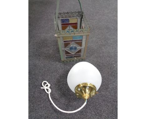 An antique metal gas hanging lamp with four stained glass panels together with a  further light fitting with opaque glass sha