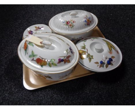 A tray of three Royal Worcester lidded oven dishes and four saucers 