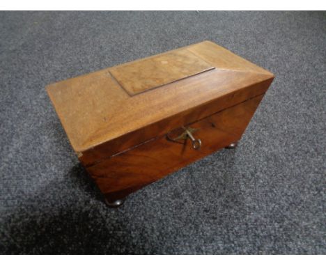 A 19th century mahogany tea caddy with key 