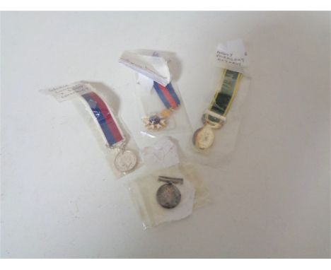 Four miniature medals on ribbons - George V long service &amp; good conduct, St. Michael &amp; St. George, George V 1914-18 &