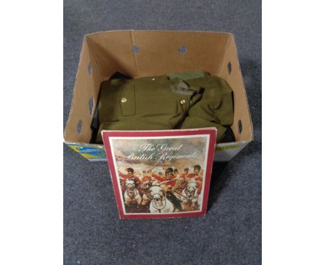 A box of Great British regiments cap badges, army tunic, St. Johns Ambulance coat etc 