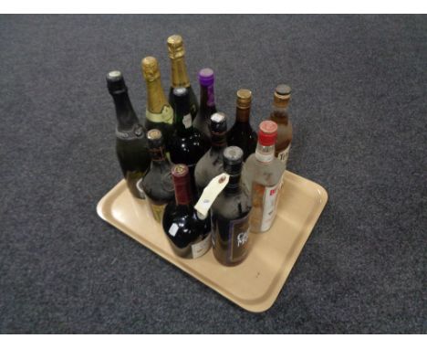 A tray of thirteen bottles of alcohol - Beef eater gin, Capt. Morgan rum, Teachers Scotch etc 