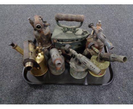 A tray of six vintage blow lamps and an iron 
