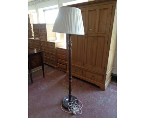 A standard lamp and shade 
