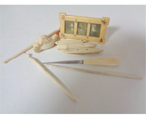 A carved meerchaum pipe together with antique ivory tools etc.