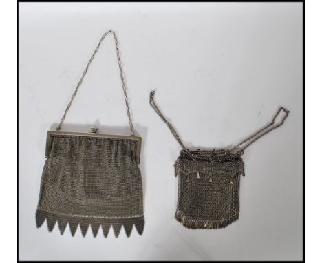 A pair of early 20th Century Edwardian ladies evening purses of silver plated / white metal mesh construction. One having mes
