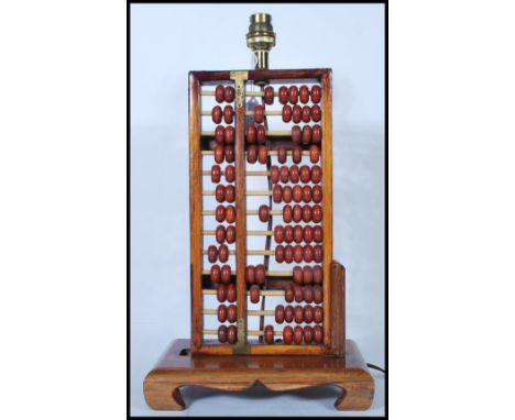 A retro mid 20th Century 1960's table lamp in the form of a Chinese abacus&nbsp;of typical beaded form, the top with applied 