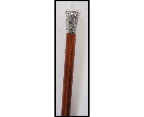 A 20th Century walking stick cane having a malacca shaft with silver knop to the top having repousse decoration of the Hampsh