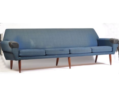 An original 1970's Danish retro vintage four seat sofa settee having a blue velour patterned fabric upholstery with four seat