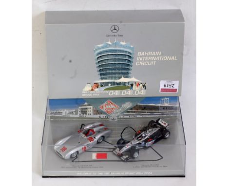 A Minichamps 1/43 scale model Mercedes Benz W196/Maclaren Formula One Bahrain Grand Prix 2004 box set, limited edition exampl