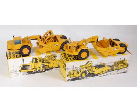 An NZG 1:50 scale boxed Caterpillar construction diecast group to include a No.260 Caterpillar 615 elevating scraper, togethe