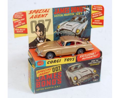 A Corgi Toys No. 261 James Bond Aston Martin DB5 comprising gold body with red interior and wire work hubs with James Bond fi