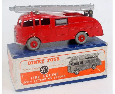 A Dinky Toys No. 555 fire engine with extending ladder comprising red body with red hubs and silver ladder, in the original o