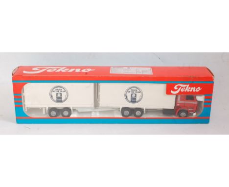 A Tekno 1:50 scale boxed model of a Scania R143M 6x2 rigid truck and matching box trailer, finished in red and silver with al