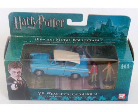 A Corgi Toys modern release Harry Potter Mr Weasley's Ford Anglia gift set with Harry Potter and Ron Weasley figure, sold in 