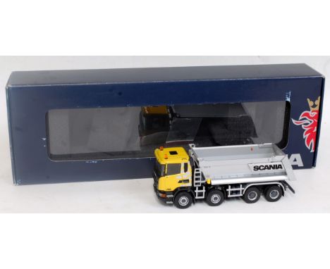 A Tekno Models 1:50 scale model of a Scania G450 8x4 off-road tipper truck, comprising yellow and black cab/chassis with silv