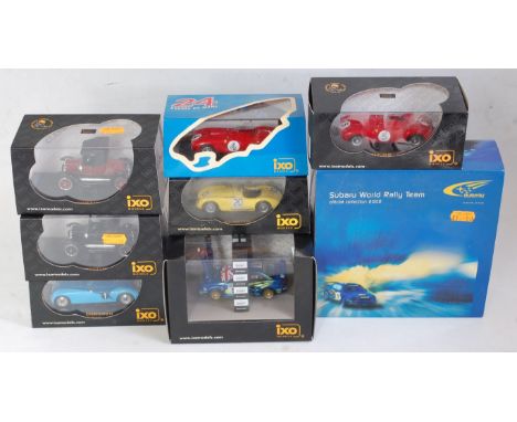 An Ixo Models and an Auto Art 1:43 scale racing car boxed group, eight examples in total to include Subaru World Rally Team O
