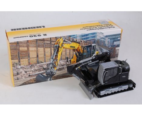 A Conrad No. 2209/02 1:50 scale model of a Liebherr R920 compact tracked excavator, limited edition black example, in the ori