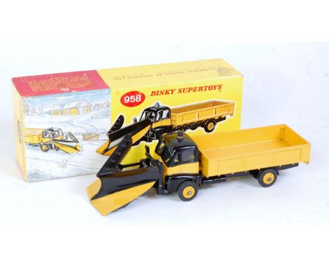 A Dinky toys No. 958 snowplough, comprising black and yellow body with yellow Supertoys hubs and blue light, sold in the orig